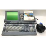 AMSTRAD PPC640 VINTAGE PORTABLE PERSONAL COMPUTER. This machine fires up and is asking for a disc.