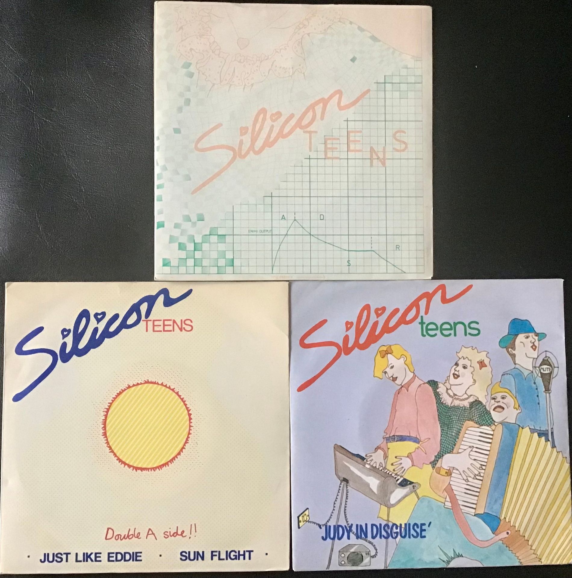 3 X SILICON TEENS SINGLE RECORDS. Here we have titles - Memphis Tennessee - Just Like Eddie and Judy