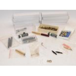 Box containing spares for pen repairs/refurbishment. Includes pumps, pencil nozzles, clips,