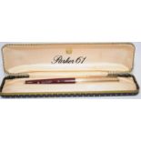 Parker P61 Consort Series III fountain pen with maroon body and rolled gold cap. Good chalk, near