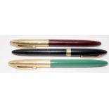 Three vintage Sheaffer fountain pens. Two Snorkel Crest models and a Sheaffer Admiral. All feature