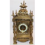 Ornate French brass striking mantle clock of square form approx 48cm tall