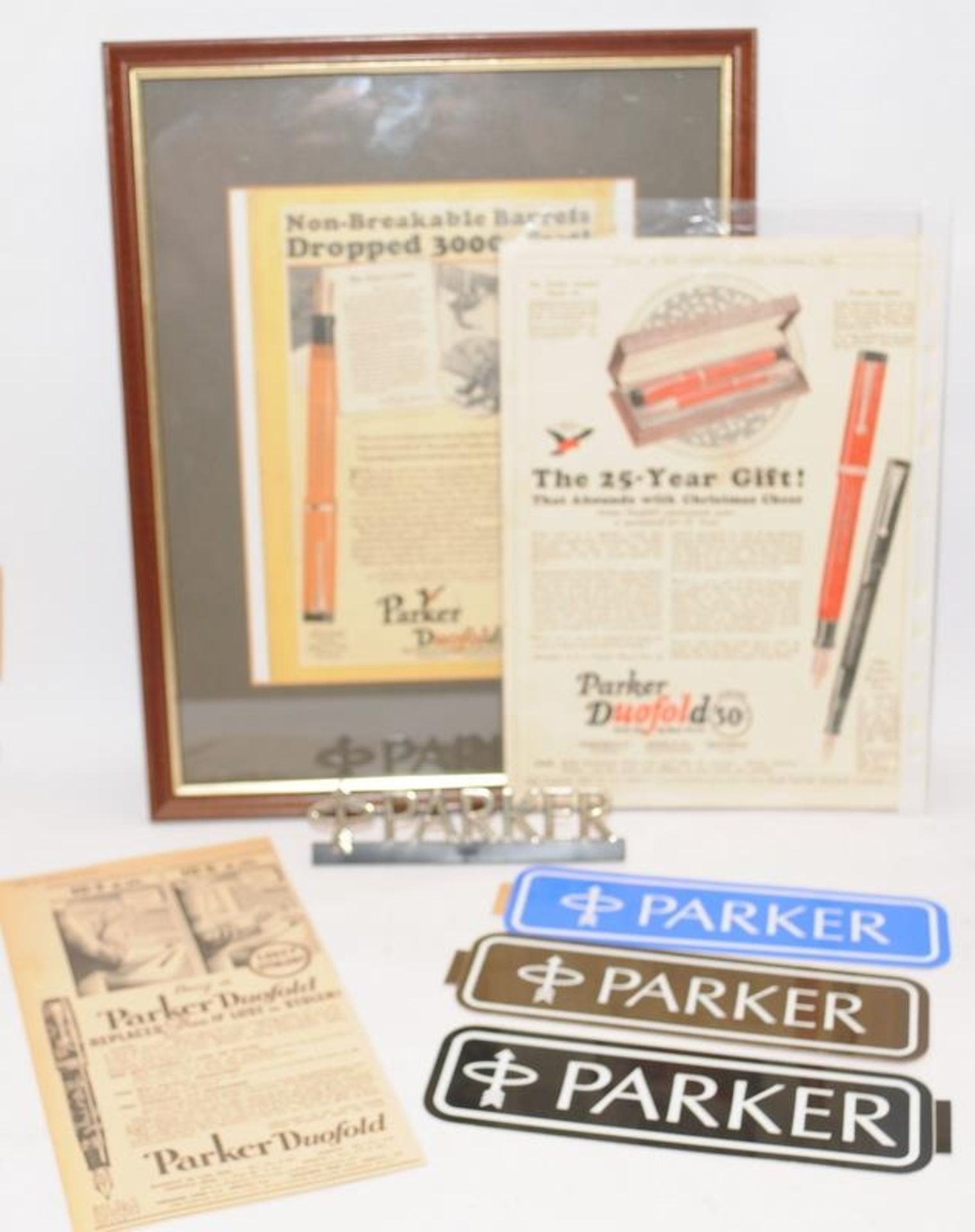 Vintage advertising ephemera to include unused Parker dealer signs, a freestanding Parker desk sign,