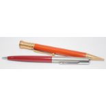 Parker Duo Fold Junior propelling pencil with orange body c/w a further Parker propelling pencil