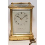 Antique brass fusee carriage clock by G & W Yonge, presented in working condition with key.