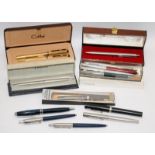 A collection of vintage fountain pens and ballpoint pens with examples by Parker, Shaeffer and