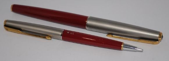 Parker 61 Series 1 fountain pen and LL mechanical pencil in Rage Red with Lustraloy cap. Near