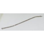 An 18ct white gold diamond tennis bracelet in a rub over setting 2.9ct total.