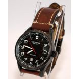 Victorinox Airboss black face automatic gents watch on tan leather strap with deployment clasp. 46mm