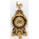Antique French faux tortoiseshell Boulle mantle clock with ormolu mounts on outswept feet
