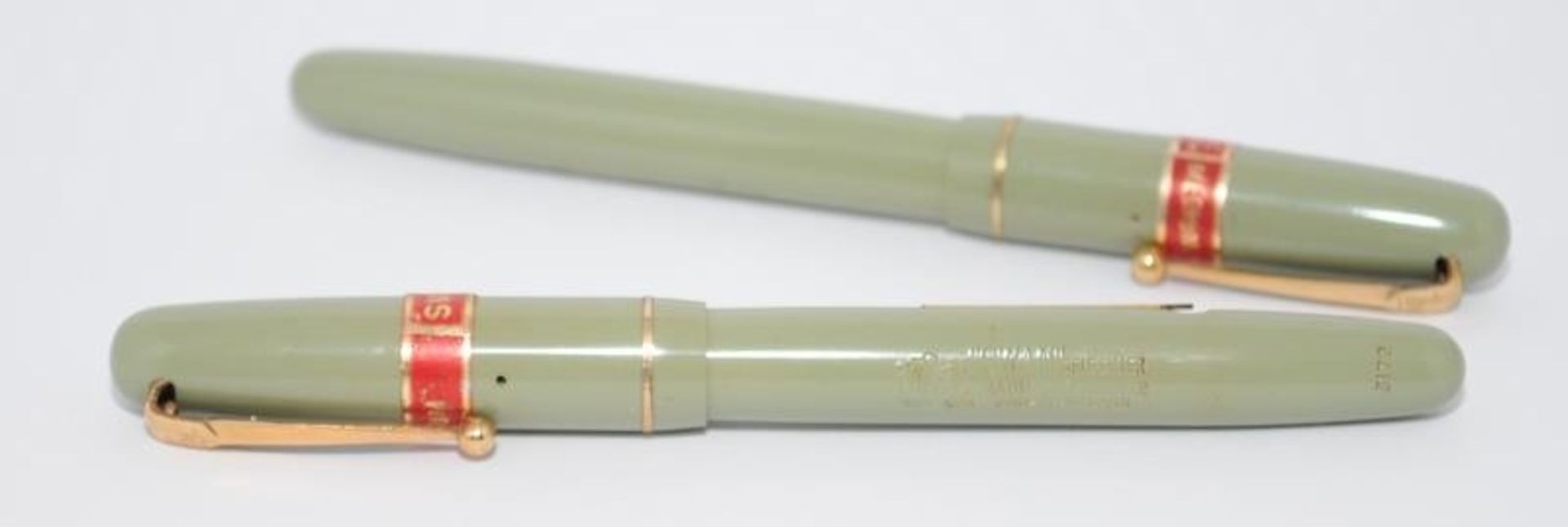 Pair of Swan self fill 312 fountain pens in pastel green. Factory sleeves still attached poss NOS.