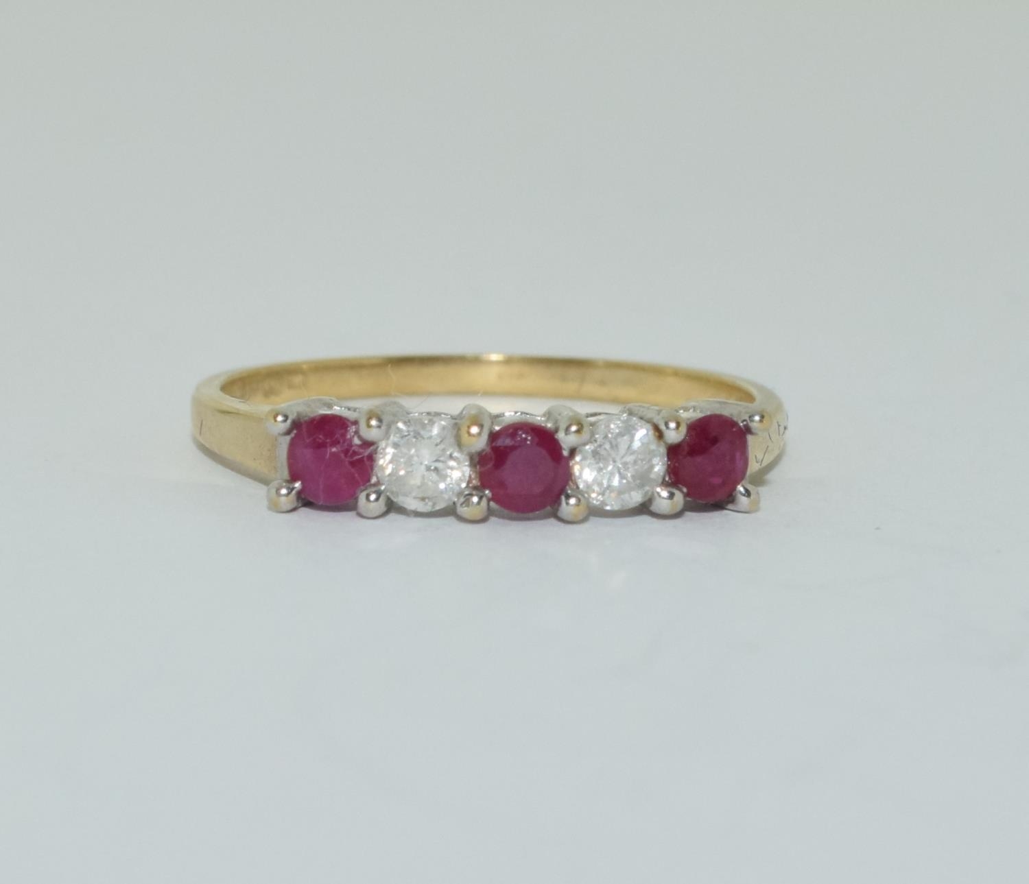 Ruby and diamond Five stone 9ct gold ring, Size M 1/2.