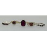 Collection of 5 vintage garnet and sapphire sterling silver rings.