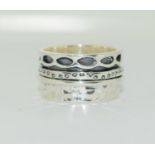 A 925 silver moving designer band ring Size R