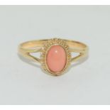 A pink Coral solitaire set in 9ct gold ring Size P