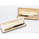 Pair of vintage boxed Parker pens to include a P61 black with rainbow cap and a Parker 61 black De