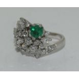 18ct white gold Diamond and Emerald designer ring with Valuation certificate as £5800 size O