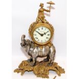 Ornate mantel clock in the form of an oriental figure sat upon an elephant with gilded foliage. Dial