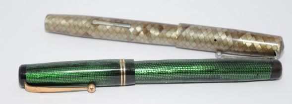 Two vintage Swan pens to include a Silver snakeskin fountain pen with chrome clip and ebonite
