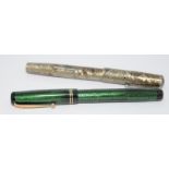 Two vintage Swan pens to include a Silver snakeskin fountain pen with chrome clip and ebonite