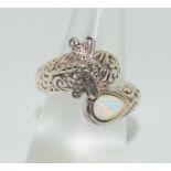 A silver opal paneled butterfly style ring Size O