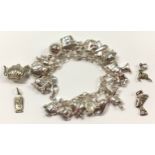 Silver charm bracelet together with quantity of charms approx (20)