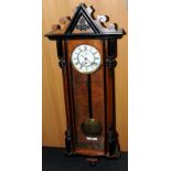 Walnut single weight Ebonized enamel dial Vienna wall clock with brass pendulum by "Gustav Becker"