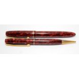 Vintage Blackbird fountain pen and propelling pencil set in red/maroon marble. Fountain pen fitted