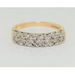 A Diamond 7 stone 9ct gold ring, Size