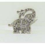 A silver and marcasite elephant brooch.