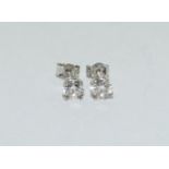 A pair of 18ct w/g diamond stud earrings of 1.1ct.