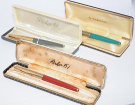 Three vintage boxed Parker fountain pens to include Parker 61 Series 1 in Rage Red with red and