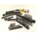 Box containing 50+ pieces of OO gauge mixed track, connectors and 3 OO gauge vehicles.