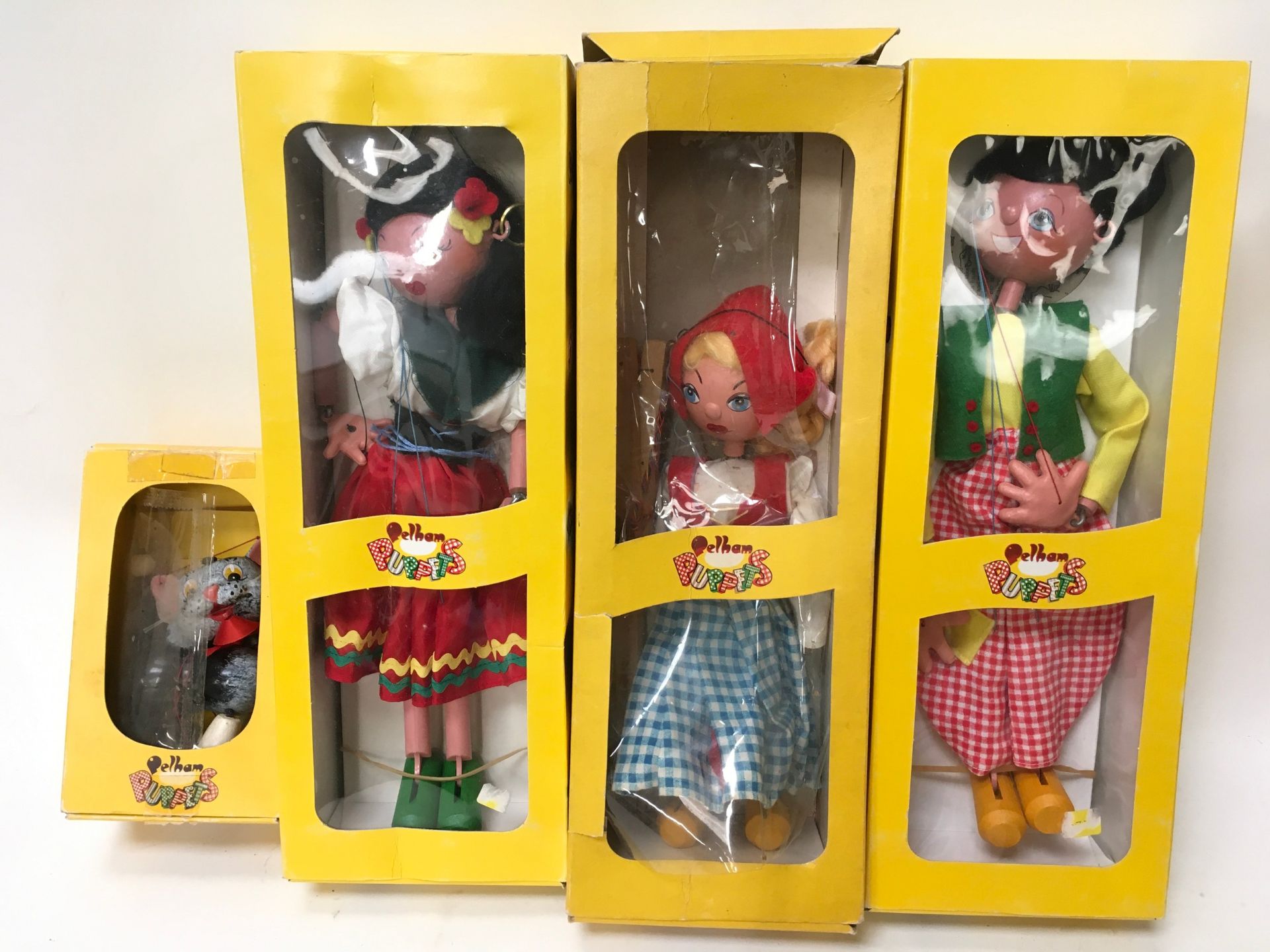 Four Boxed Pelham Puppets: SS1 Dutch Boy, SS Dutch Girl, SS3 Gypsy and a Cat.