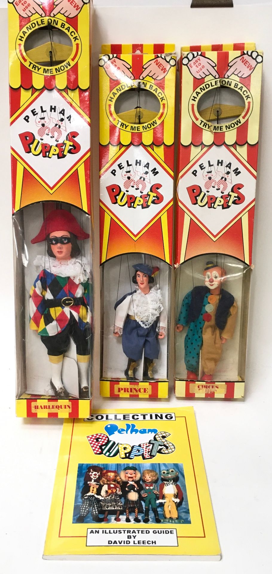 3 boxed Pelham Puppets and a Collecting Pelham Puppets book: Harlequin, Prince and Circus Clown.