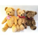 Two vintage teddies and another.
