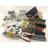Box containing 20+ scenic buildings and accessories to include figures, crossing, platforms etc.