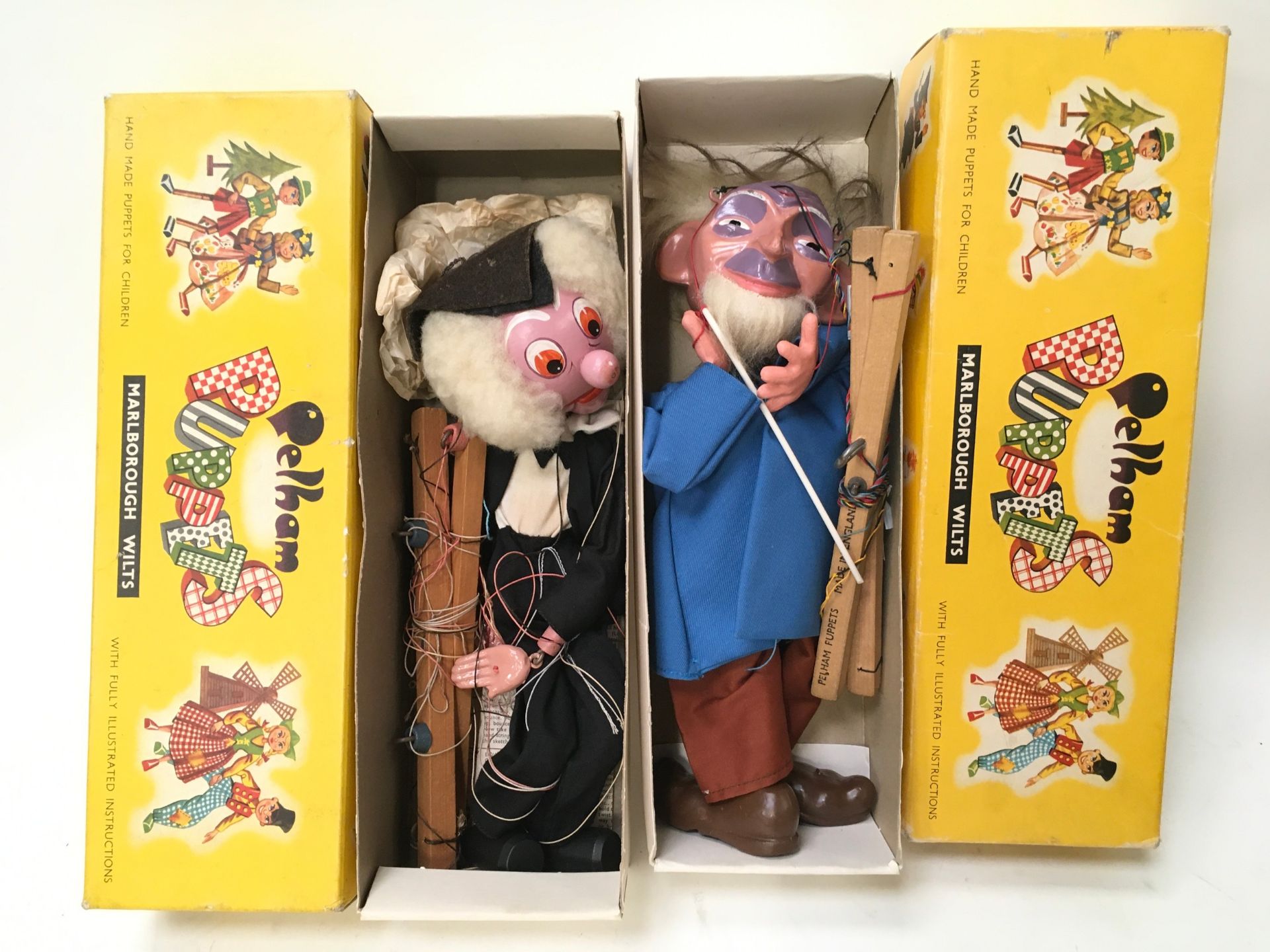 Pair of Pelham Puppets: SL27 Old Man and SM School Master in correct yellow carded boxes.