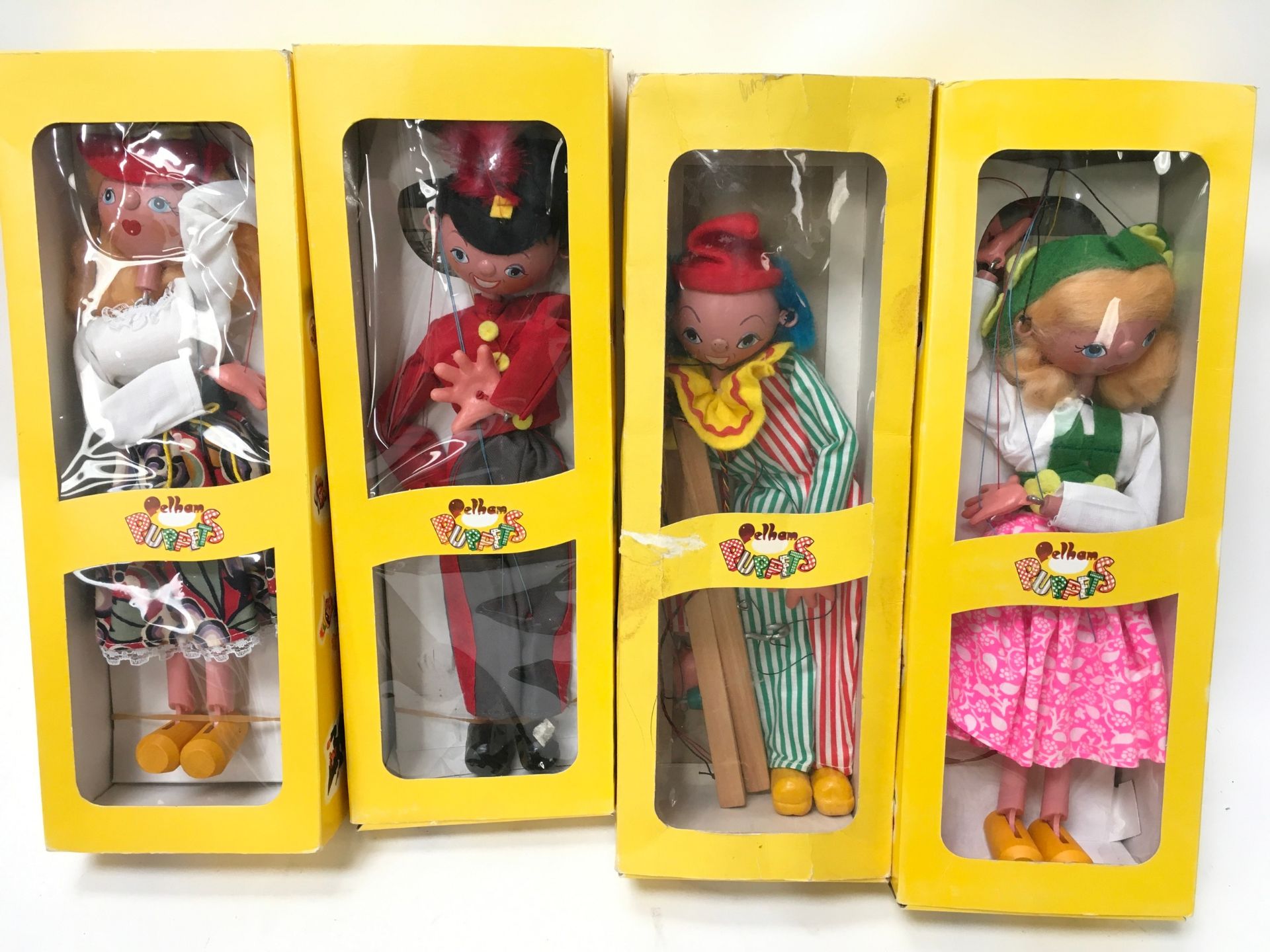 4 Boxed Pelham Puppets: SS5 Tyrolean Girl, SS6 Clown, SS7 Fritzi, SS8 Mitzi. All in yellow window