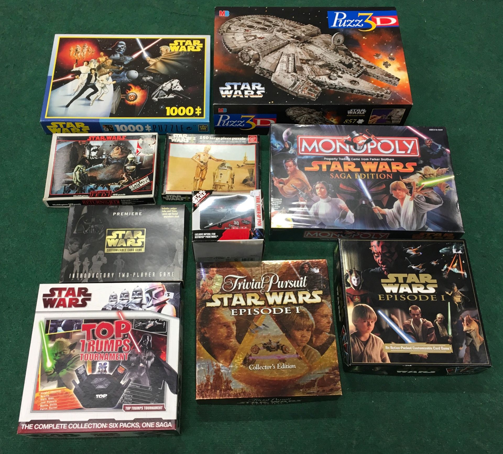 Collection of Star Wars games and puzzles to include Monopoly (sealed), Top Trumps Tournaments,