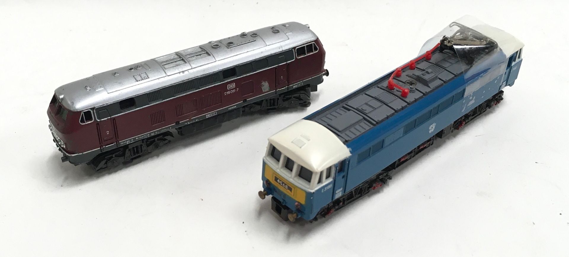 2 N gauge diesel/Electric locomotives - Rivarossi 215 and Lima 3185. Both appear in Good condition.