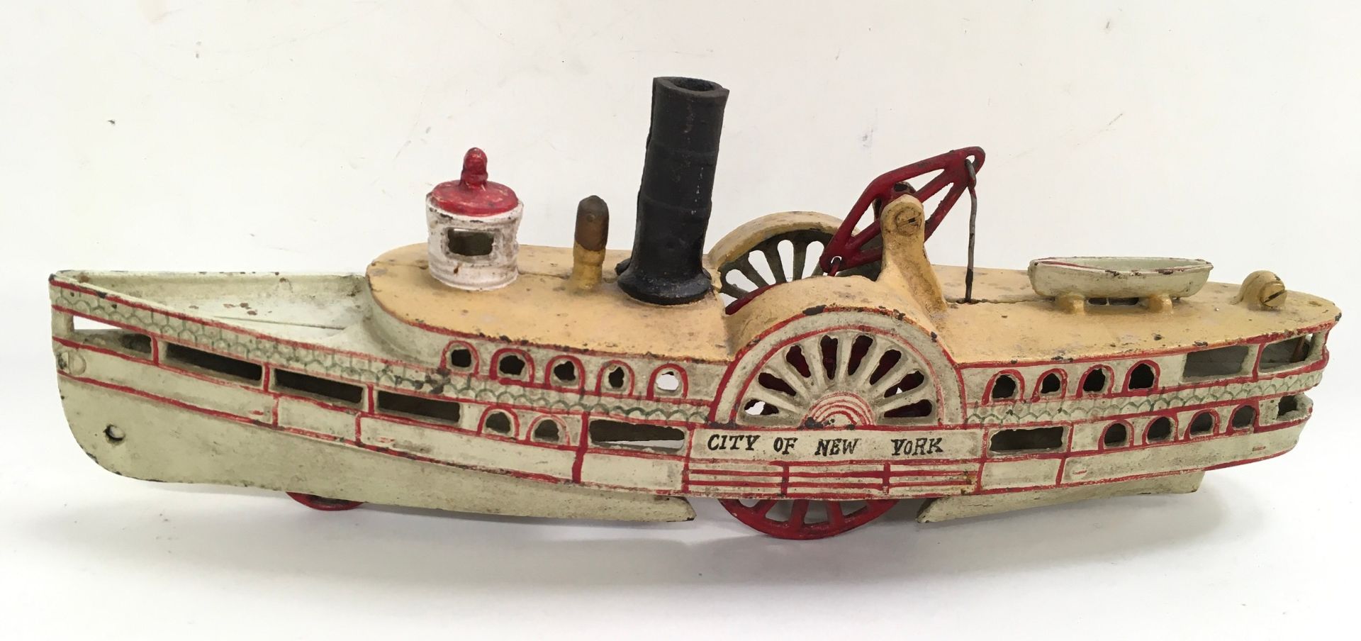 Cast Iron model of a paddle boat, believed to be Wilkins.