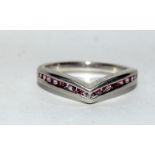 A wishbone silver 925 ring with pink gem stones. Size P