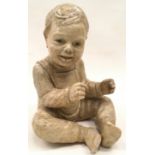 Large resin figure of a seated small boy, indistinct signature to figure. Approx 33cms tall