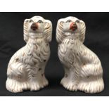 Pair of Victorian Staffordshire pottery spaniel dog ornaments each 16cm tall.