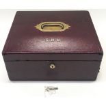 Leather travelling jewellery box with hidden compartment with a Bramah lock and key, watered silk