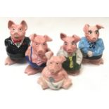 Complete family of five Wade Natwest ceramic piggy banks.
