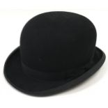 Vintage black Bowler Hat retailed by Harrods. In excellent condition. Internal circumference