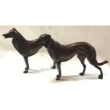 A bronze statue of a pair of dogs. (126)