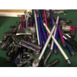 Large collection of assorted Dyson cordless vacuum cleaner spare parts to include motors, tubes